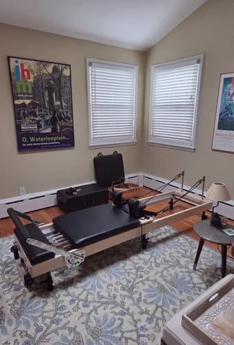 A Studio Reformer set up in a bright home studio