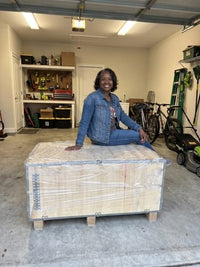 Ashley with her Studio Reformer crate on delivery day