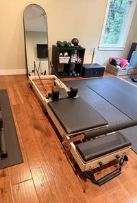 A Studio Reformer in a bright living room