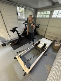 Jenna's reformer set up in her garage